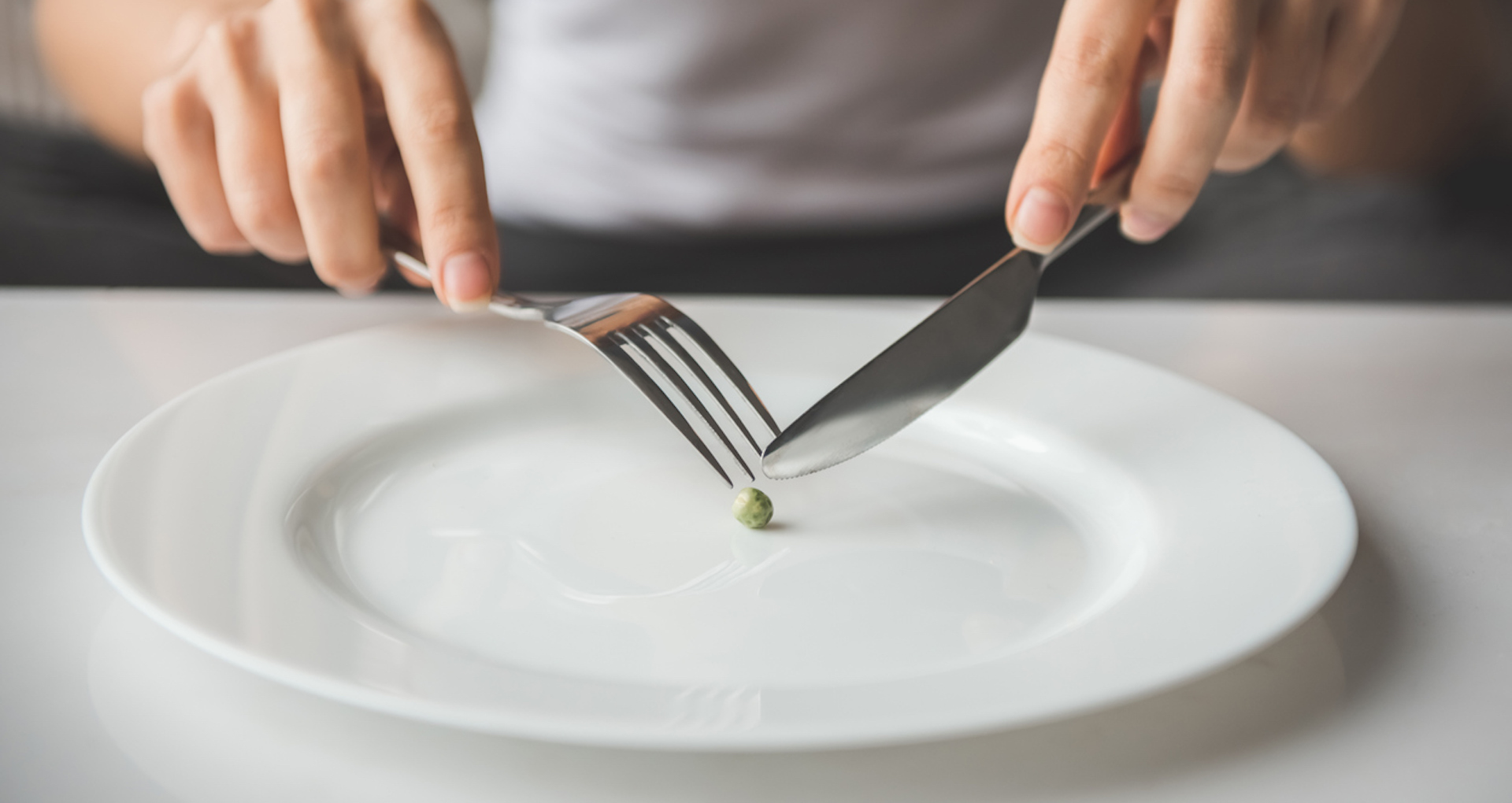 Someone chasing a pea around a plate