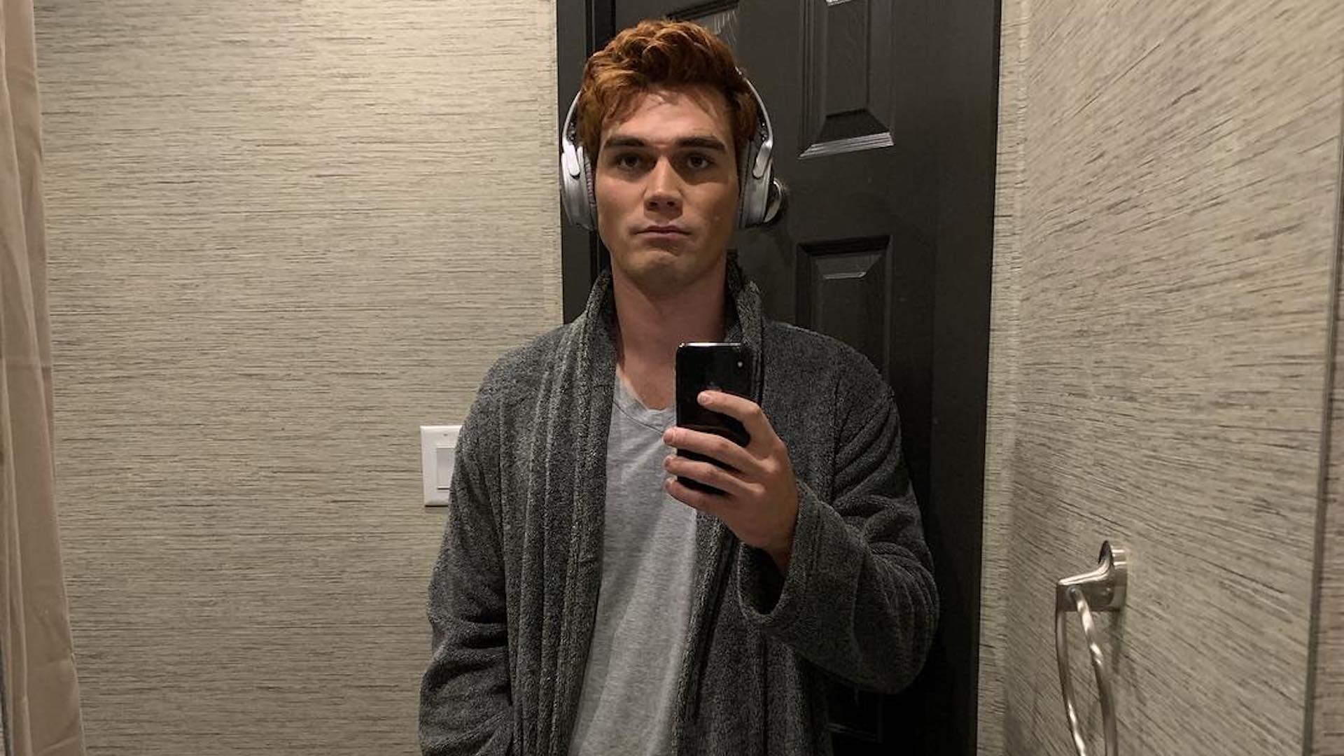 KJ Apa taking a selfie in the mirror